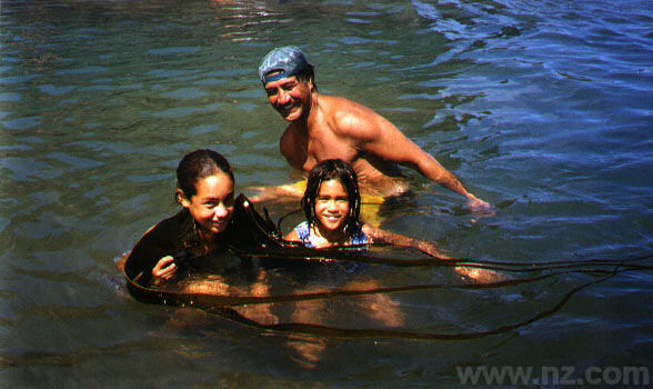 Piha, Family exploring rockpools